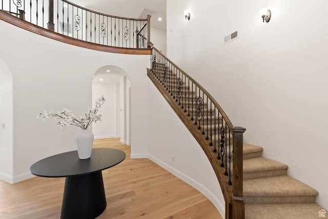3134 S 355 W, Washington, UT 84780 - stairs with arched walkways, wood finished floors, baseboards, a towering ceiling, and recessed lighting