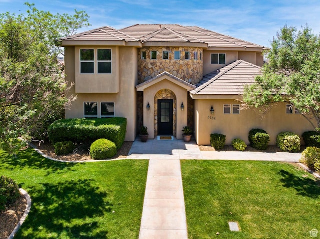 3134 S 355 W, Washington, UT 84780 - view of front of property featuring stucco siding, a front yard, a tile roof, and stone siding