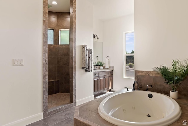 3134 S 355 W, Washington, UT 84780 - bathroom featuring a jetted tub, walk in shower, baseboards, vanity, and healthy amount of natural light