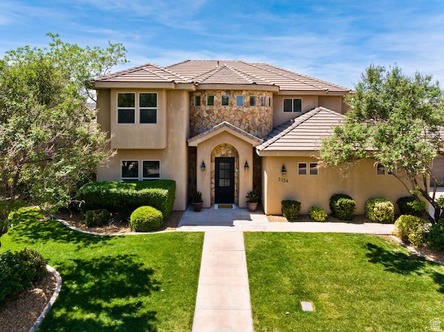 3134 S 355 W, Washington, UT 84780 - view of front facade featuring stucco siding, a front lawn, and a tiled roof