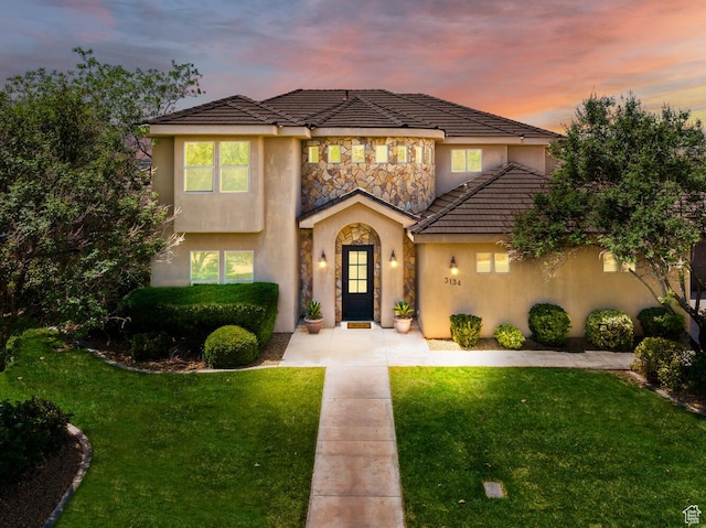 3134 S 355 W, Washington, UT 84780 - view of front of property with stucco siding, a front yard, and a tile roof
