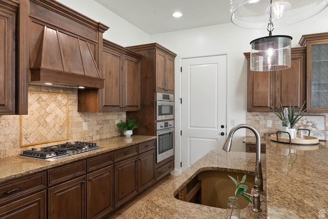 3134 S 355 W, Washington, UT 84780 - kitchen featuring a sink, custom range hood, stainless steel appliances, light stone countertops, and decorative backsplash