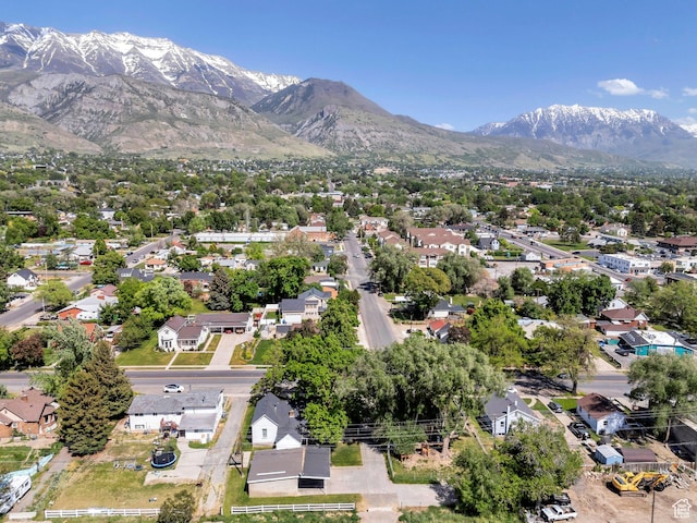 view of property location with mountains and nearby suburban area