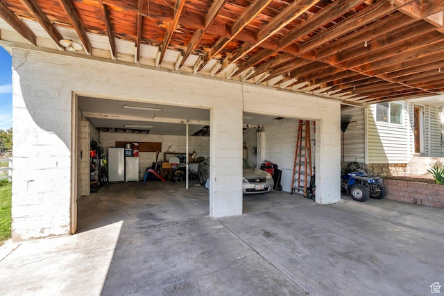 garage with concrete driveway