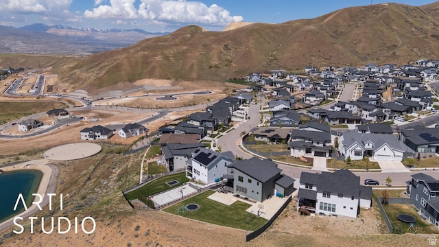 view of property location with nearby suburban area and mountains