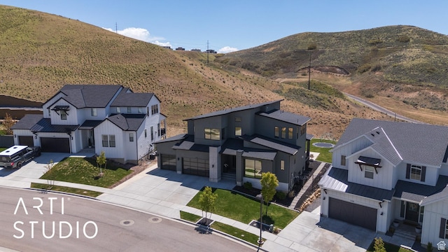 aerial view of residential area featuring a mountainous background