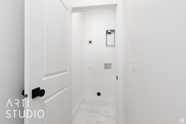 washroom featuring baseboards, electric dryer hookup, light marble finish flooring, and washer hookup