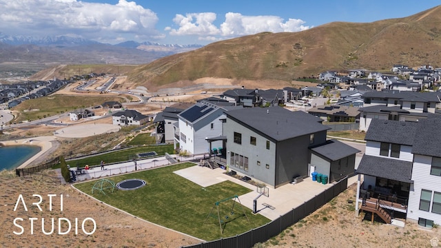 aerial view of residential area with mountains