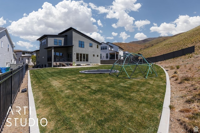 view of yard with a trampoline