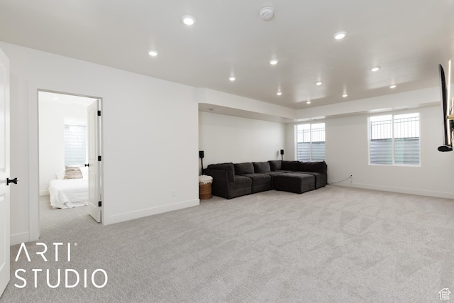 living room with carpet flooring, recessed lighting, and baseboards