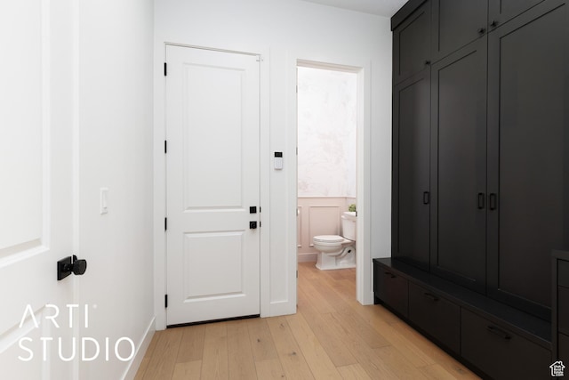 bathroom with wood finished floors and toilet