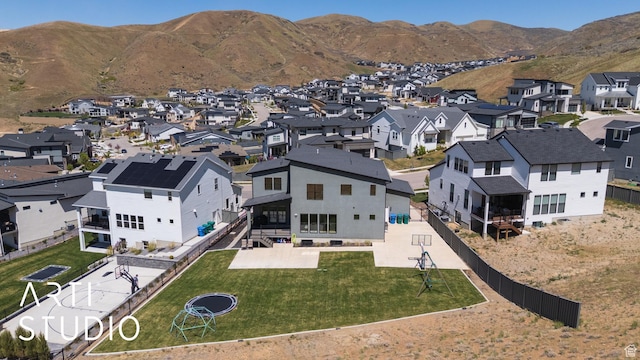 aerial perspective of suburban area with a mountainous background