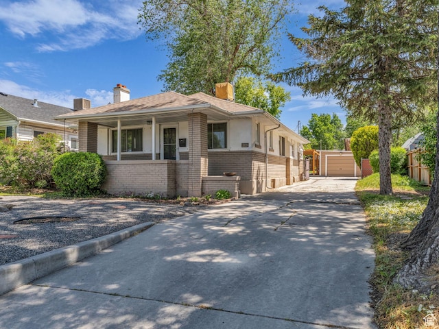 2829 S 900 E, Millcreek, UT 84106 - view of front of house featuring brick siding, a chimney, covered porch, fence, and driveway