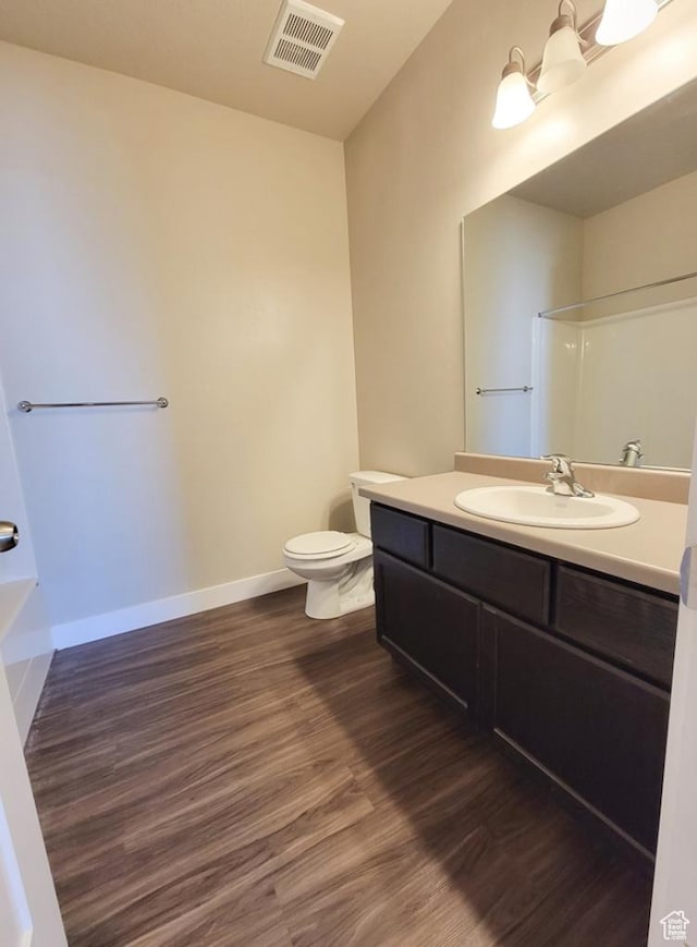 14643 S Mckellen Dr W Unit D302, Herriman, UT 84096 - full bath featuring wood finished floors, toilet, vanity, baseboards, and a shower