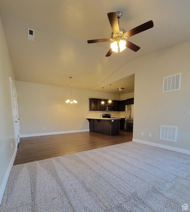 14643 S Mckellen Dr W Unit D302, Herriman, UT 84096 - unfurnished living room with carpet, vaulted ceiling, a ceiling fan, baseboards, and a chandelier