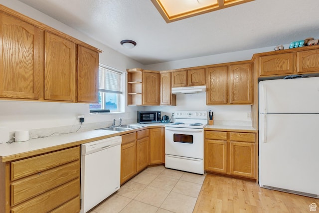 kitchen featuring white appliances, a sink, under cabinet range hood, light countertops, and open shelves