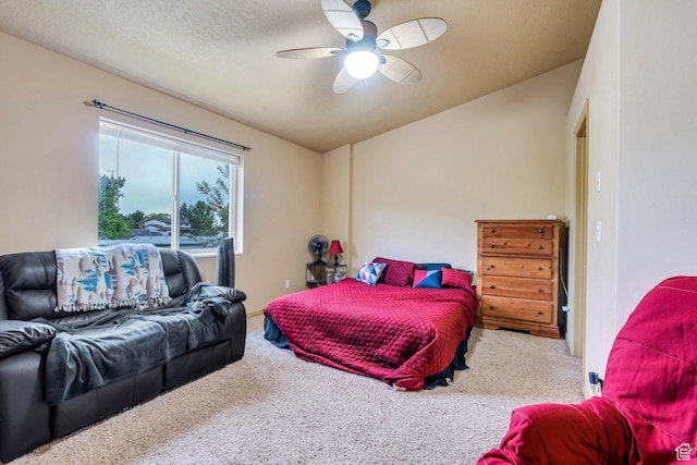 bedroom featuring carpet flooring, lofted ceiling, and ceiling fan