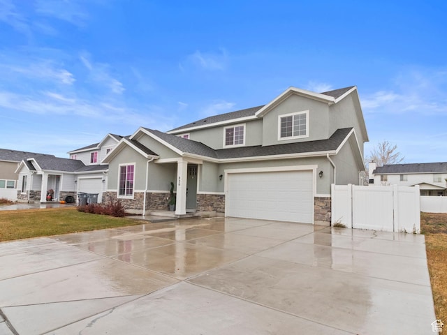 826 W 700 S, American Fork, UT 84003 - view of front of house with stone siding, stucco siding, and an attached garage