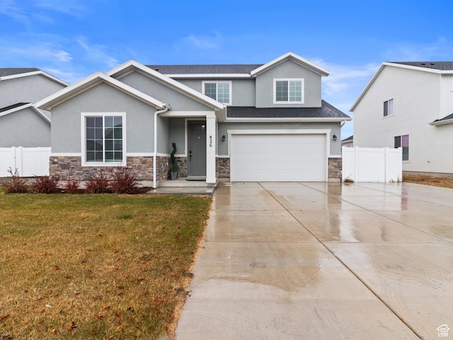 826 W 700 S, American Fork, UT 84003 - view of front of house featuring stucco siding, concrete driveway, stone siding, and an attached garage