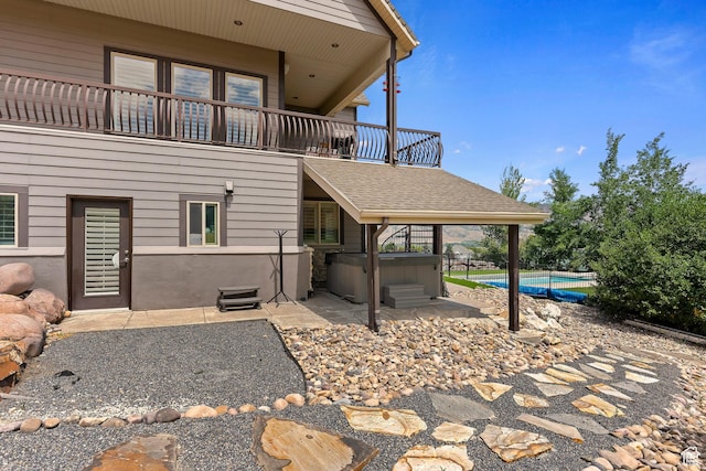 2333 S Falcon Way, Huntsville, UT 84317 - view of patio featuring a balcony, a hot tub, and a swimming pool