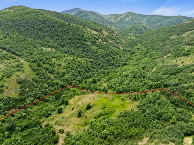 2333 S Falcon Way, Huntsville, UT 84317 - aerial overview of property's location featuring property parcel outlined, mountains, and a heavily wooded area