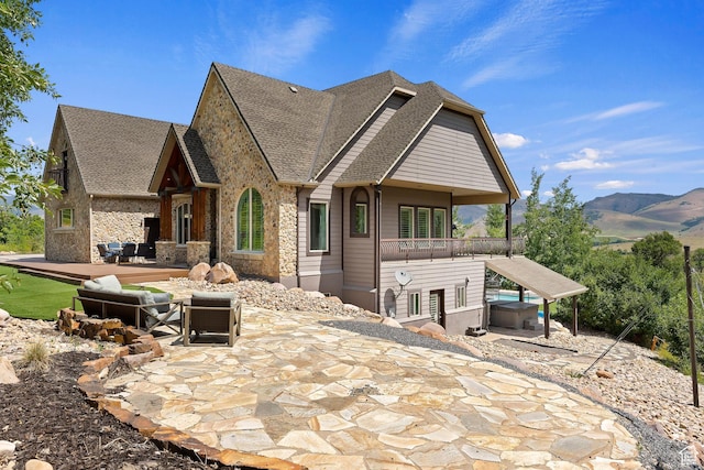 2333 S Falcon Way, Huntsville, UT 84317 - view of front of home with a patio area, a mountain view, and roof with shingles