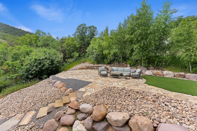 2333 S Falcon Way, Huntsville, UT 84317 - view of yard with a patio area and an outdoor hangout area