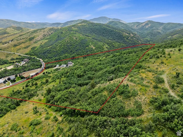 2333 S Falcon Way, Huntsville, UT 84317 - aerial overview of property's location with property parcel outlined, a mountainous background, and a heavily wooded area
