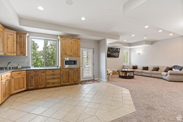2333 S Falcon Way, Huntsville, UT 84317 - kitchen with stainless steel microwave, a sink, light tile patterned flooring, recessed lighting, and light colored carpet