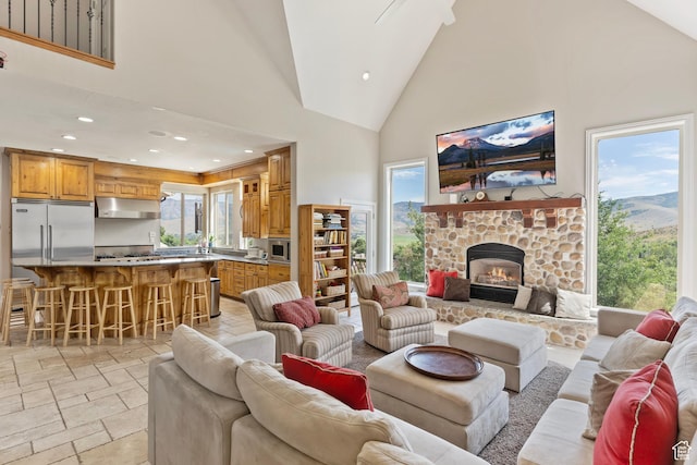 2333 S Falcon Way, Huntsville, UT 84317 - living area with high vaulted ceiling, stone tile floors, recessed lighting, and a fireplace