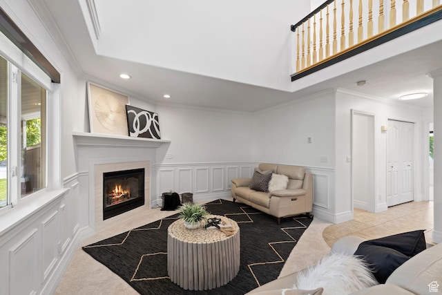 2859 W Country Classic Dr, Bluffdale, UT 84065 - living area with ornamental molding, a decorative wall, a premium fireplace, recessed lighting, and a wainscoted wall