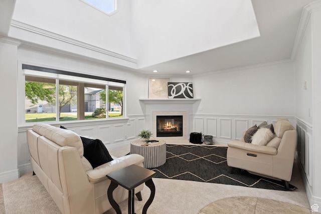 2859 W Country Classic Dr, Bluffdale, UT 84065 - living room featuring a glass covered fireplace, a decorative wall, plenty of natural light, a wainscoted wall, and ornamental molding
