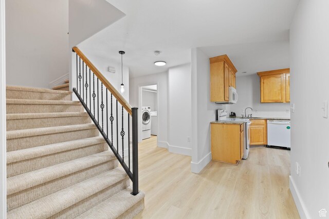 2859 W Country Classic Dr, Bluffdale, UT 84065 - stairs featuring baseboards, wood finished floors, and washer / dryer