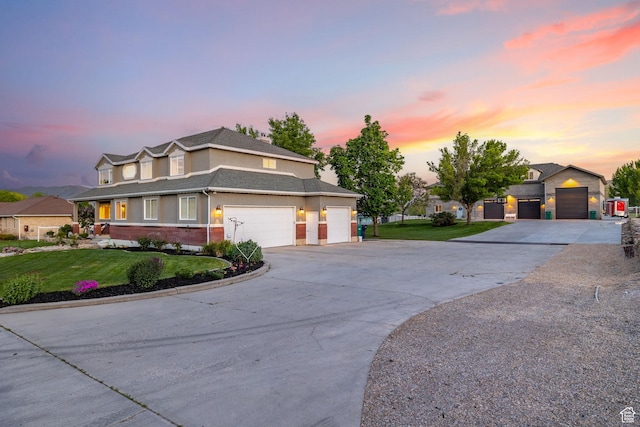 2859 W Country Classic Dr, Bluffdale, UT 84065 - view of front of house featuring concrete driveway, a yard, an attached garage, brick siding, and stucco siding