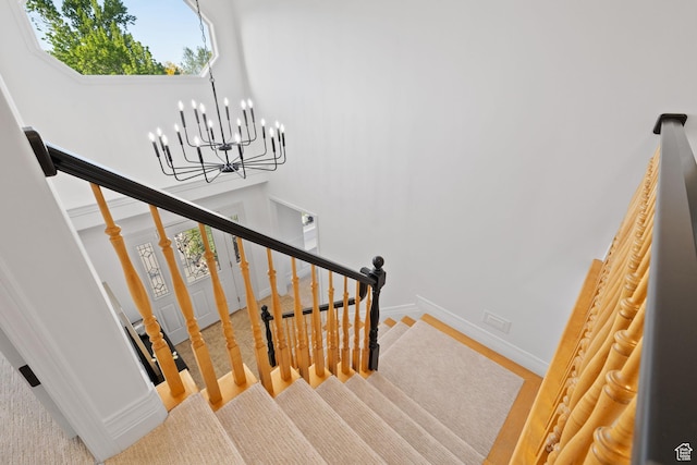 2859 W Country Classic Dr, Bluffdale, UT 84065 - stairway featuring a chandelier and baseboards
