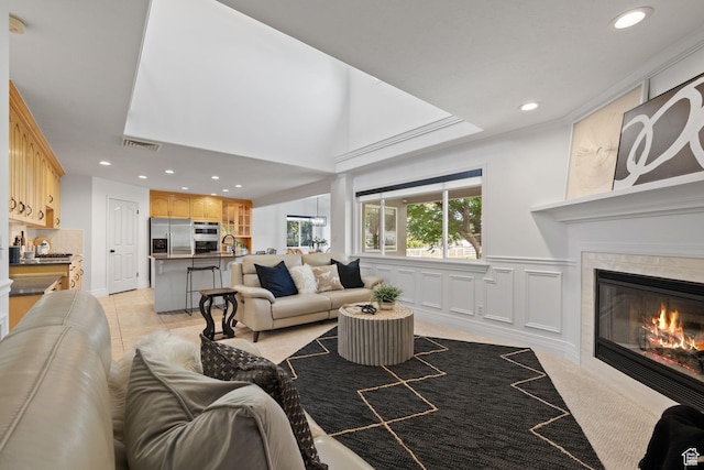 2859 W Country Classic Dr, Bluffdale, UT 84065 - living room featuring recessed lighting and a tile fireplace