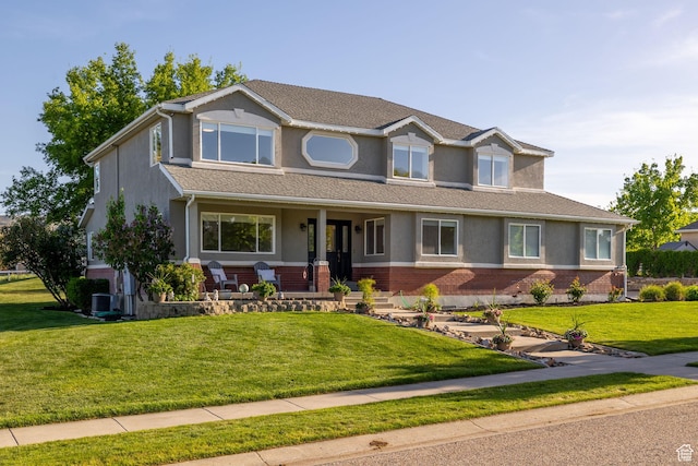 2859 W Country Classic Dr, Bluffdale, UT 84065 - view of front facade with stucco siding, brick siding, a porch, and a front yard