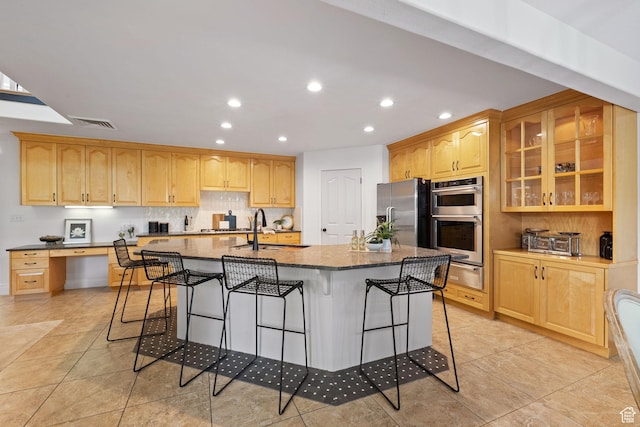 2859 W Country Classic Dr, Bluffdale, UT 84065 - kitchen with appliances with stainless steel finishes, a warming drawer, recessed lighting, a breakfast bar, and dark stone countertops