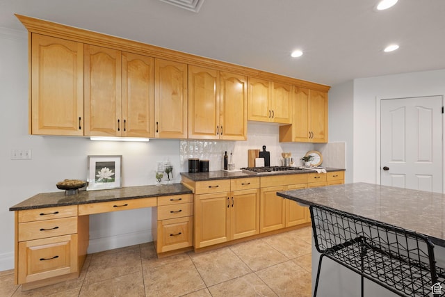 2859 W Country Classic Dr, Bluffdale, UT 84065 - kitchen featuring dark stone counters, decorative backsplash, stainless steel gas stovetop, recessed lighting, and light brown cabinetry