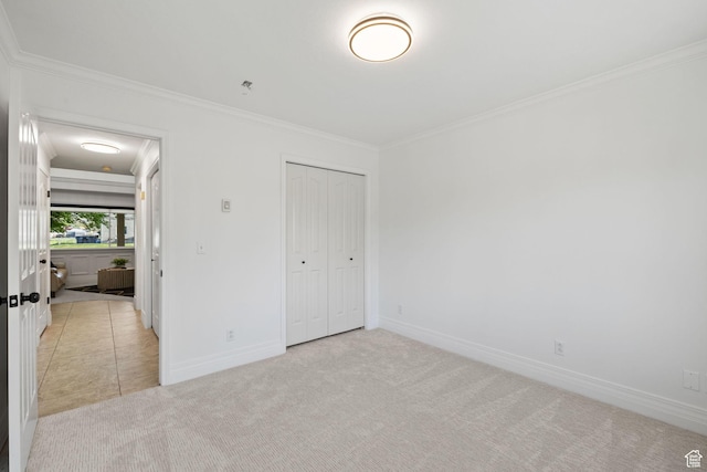 2859 W Country Classic Dr, Bluffdale, UT 84065 - unfurnished bedroom featuring crown molding, light carpet, baseboards, and a closet
