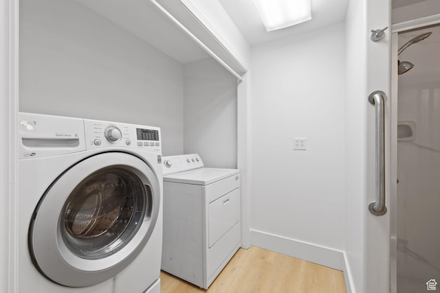 2859 W Country Classic Dr, Bluffdale, UT 84065 - laundry area with light wood-style flooring, separate washer and dryer, and baseboards