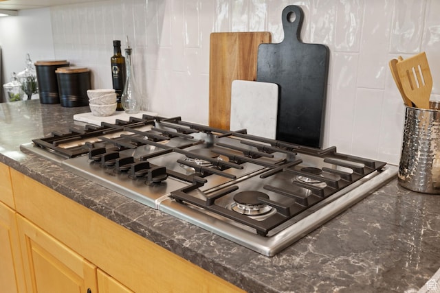 2859 W Country Classic Dr, Bluffdale, UT 84065 - kitchen view of stainless steel gas cooktop and dark countertops