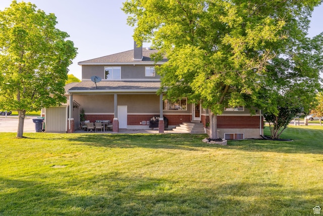 2859 W Country Classic Dr, Bluffdale, UT 84065 - back of property featuring brick siding, a lawn, roof with shingles, and a patio area