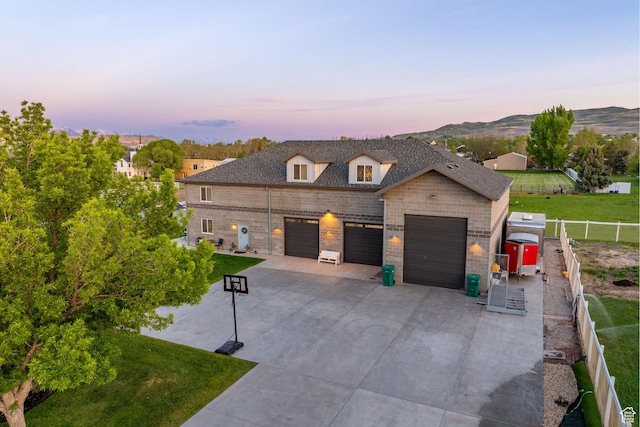 2859 W Country Classic Dr, Bluffdale, UT 84065 - view of front facade with driveway, an attached garage, and brick siding
