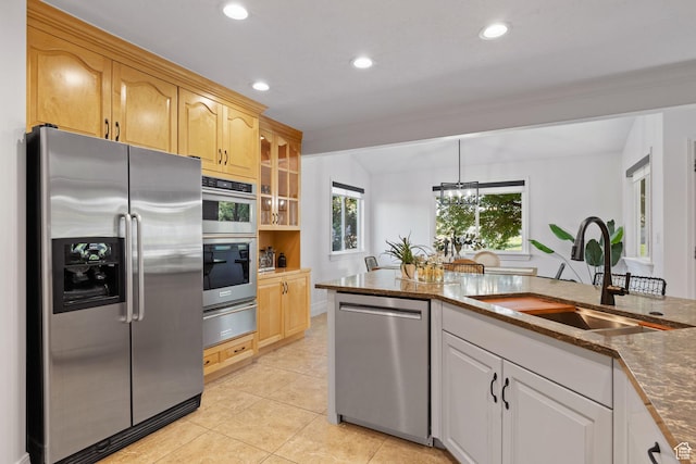2859 W Country Classic Dr, Bluffdale, UT 84065 - kitchen with stainless steel appliances, a sink, a warming drawer, dark stone counters, and glass insert cabinets