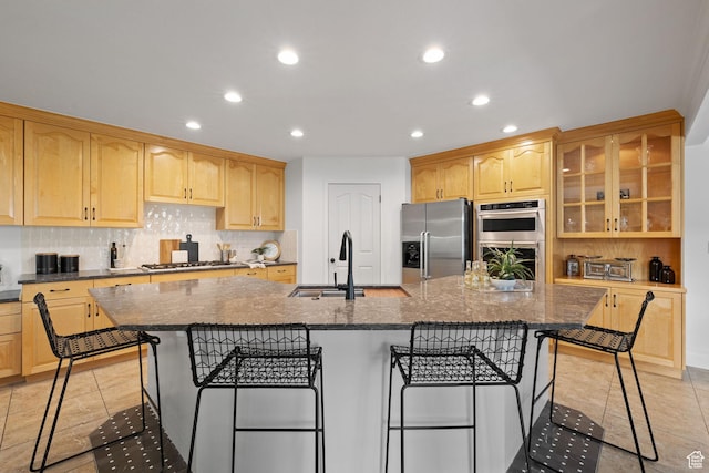 2859 W Country Classic Dr, Bluffdale, UT 84065 - kitchen with appliances with stainless steel finishes, recessed lighting, a kitchen breakfast bar, decorative backsplash, and a sink