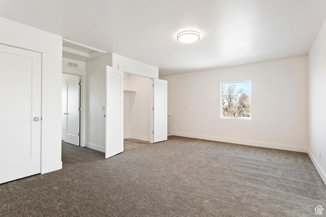 1667 W 2770 S Unit 206, Syracuse, UT 84075 - unfurnished bedroom with dark colored carpet and baseboards
