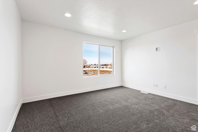 1667 W 2770 S Unit 206, Syracuse, UT 84075 - spare room with dark colored carpet, recessed lighting, and baseboards