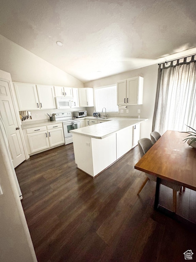 1154 S 1430 E, Provo, UT 84606 - kitchen featuring white appliances, a peninsula, vaulted ceiling, white cabinetry, and a sink