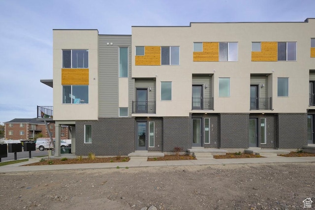 317 W Azure Sky Ln Unit 5-23, Salt Lake City, UT 84103 - view of front of home featuring stucco siding